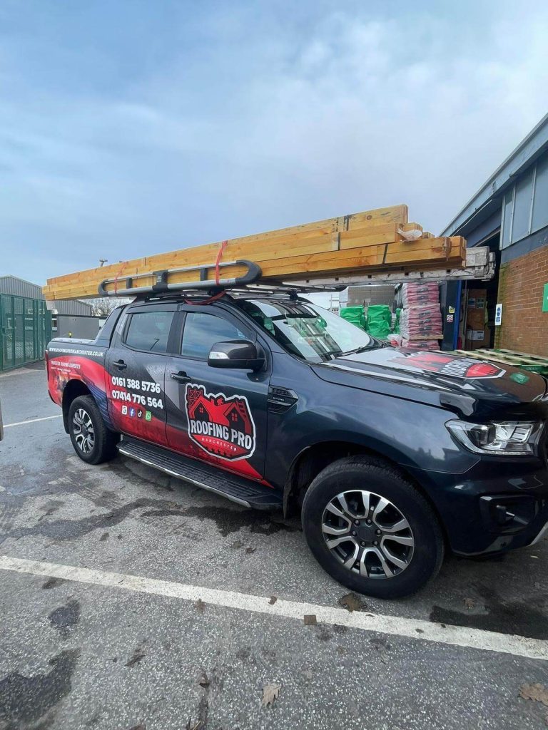 roofing pros work truck loaded with materials